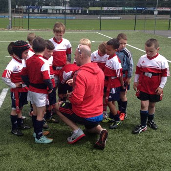 Munster Rugby Officer gives the children attending the Garryowen FC Summer Camp a few tips!